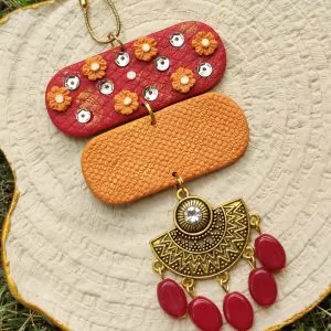 Handmade ethnic necklace for a sparkling and unique touch. And with mind-blowing striking red and orange color, be ready to enchant your friends and foes with out royal necklace. Made with trendy beads and polymer clay, flaunt charm pendant, a magical blend of eastern and western, with any shaadi attire.