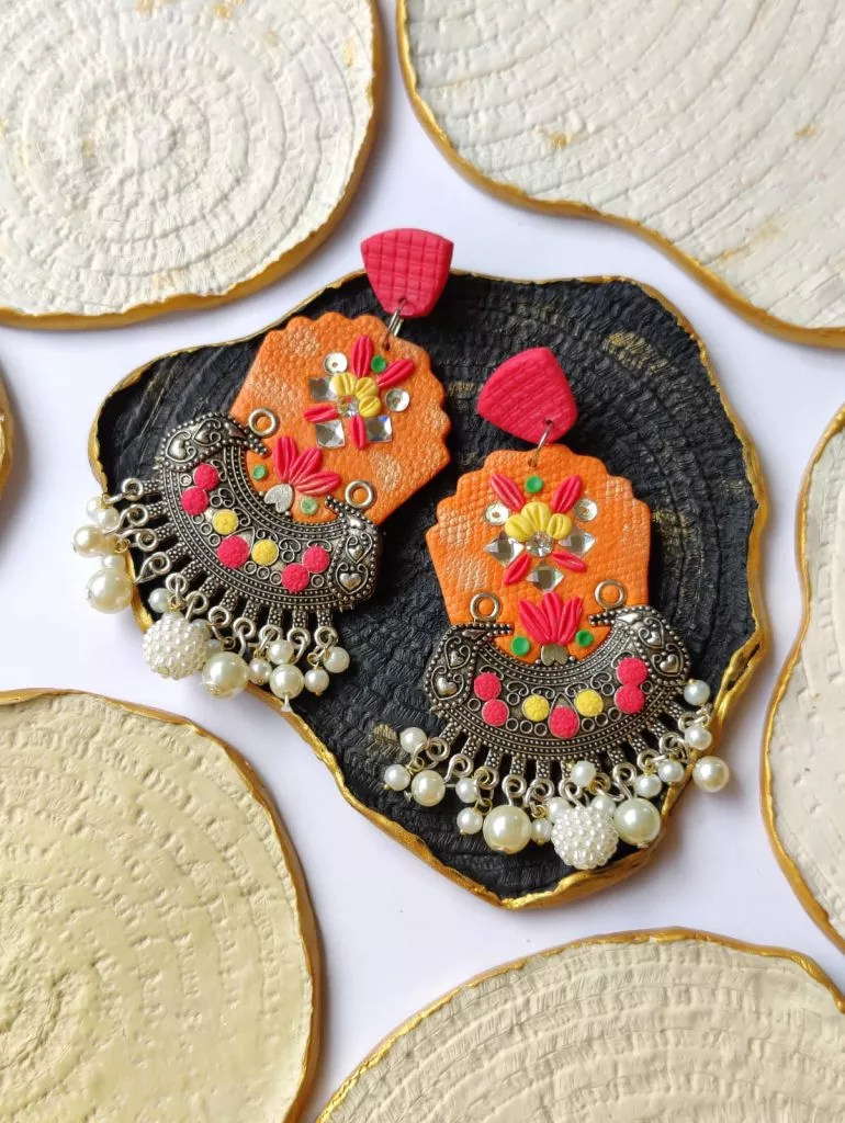 Polymer Clay Fusion Jhumka Earrings are trendy and of latest fashion in Pakistan. Handmade and lightweight, these fusion earrings are perfect for girls to stand out and create their mark.